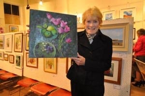 Denise Charlton and her Painitng titled 'The Pink Tulips'